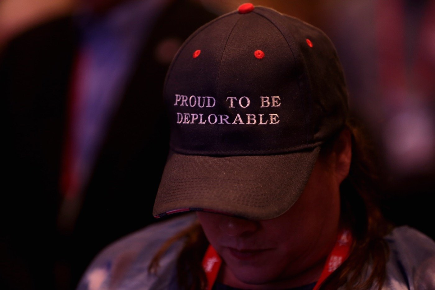Trump supporter at the Conservative Political Action Conference in 2018, wearing a hat with the phrase "Proud to be deplorable" (from Wikipedia; photo by Gage Skidmore)
